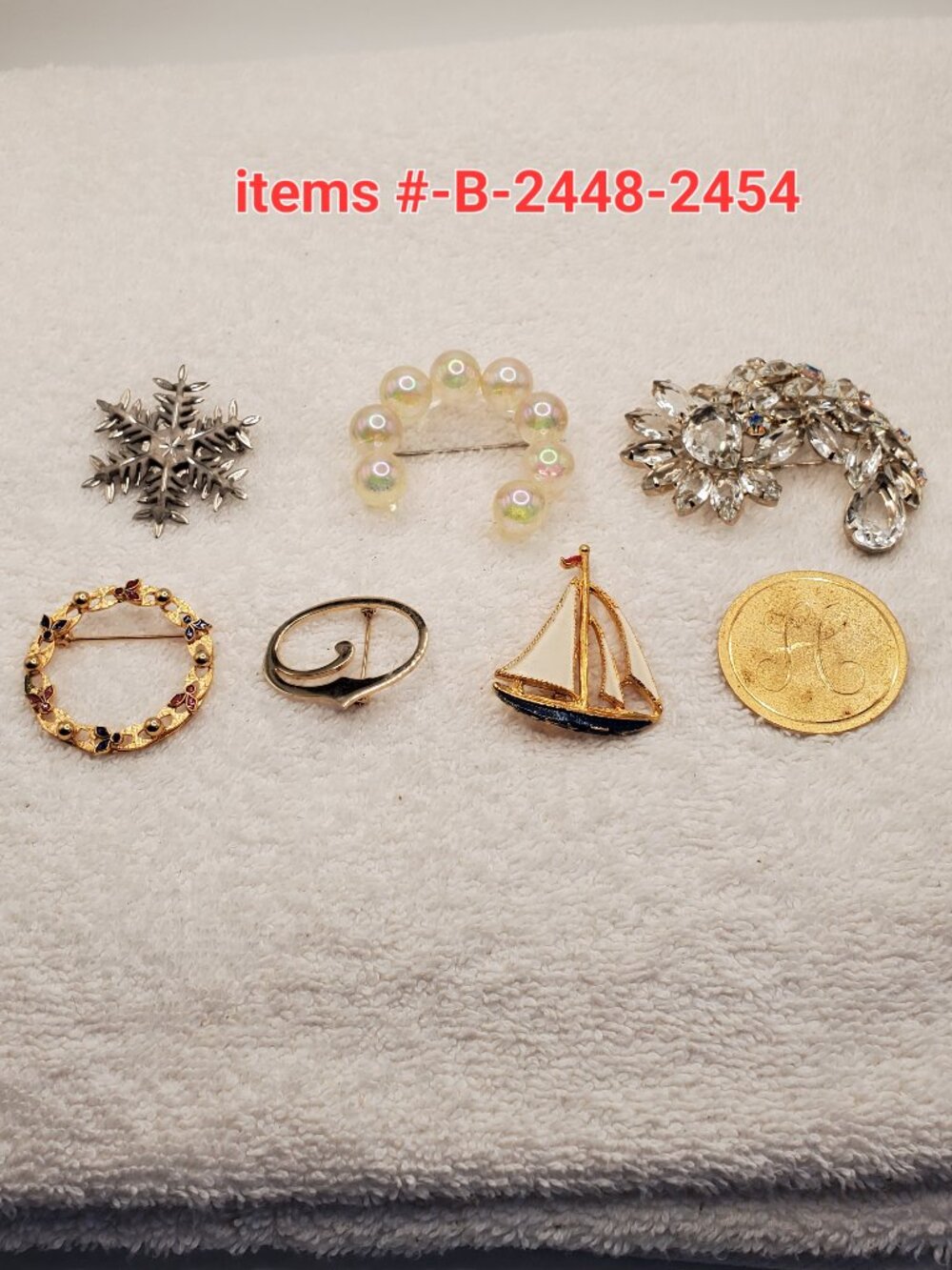 7Brooches, items # B-2448-2454,. wt. 82 grams.